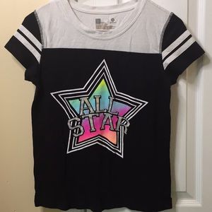 Α black t-shirt with α teal pair of shorts.